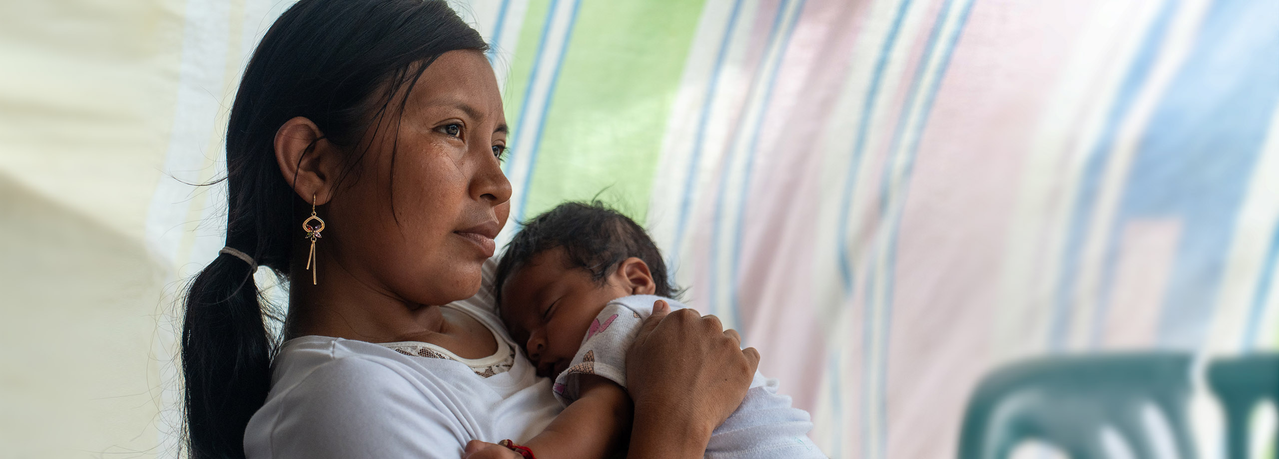 Mutter mit Baby in Flüchtlingscamp. Foto: Jakob Fuhr