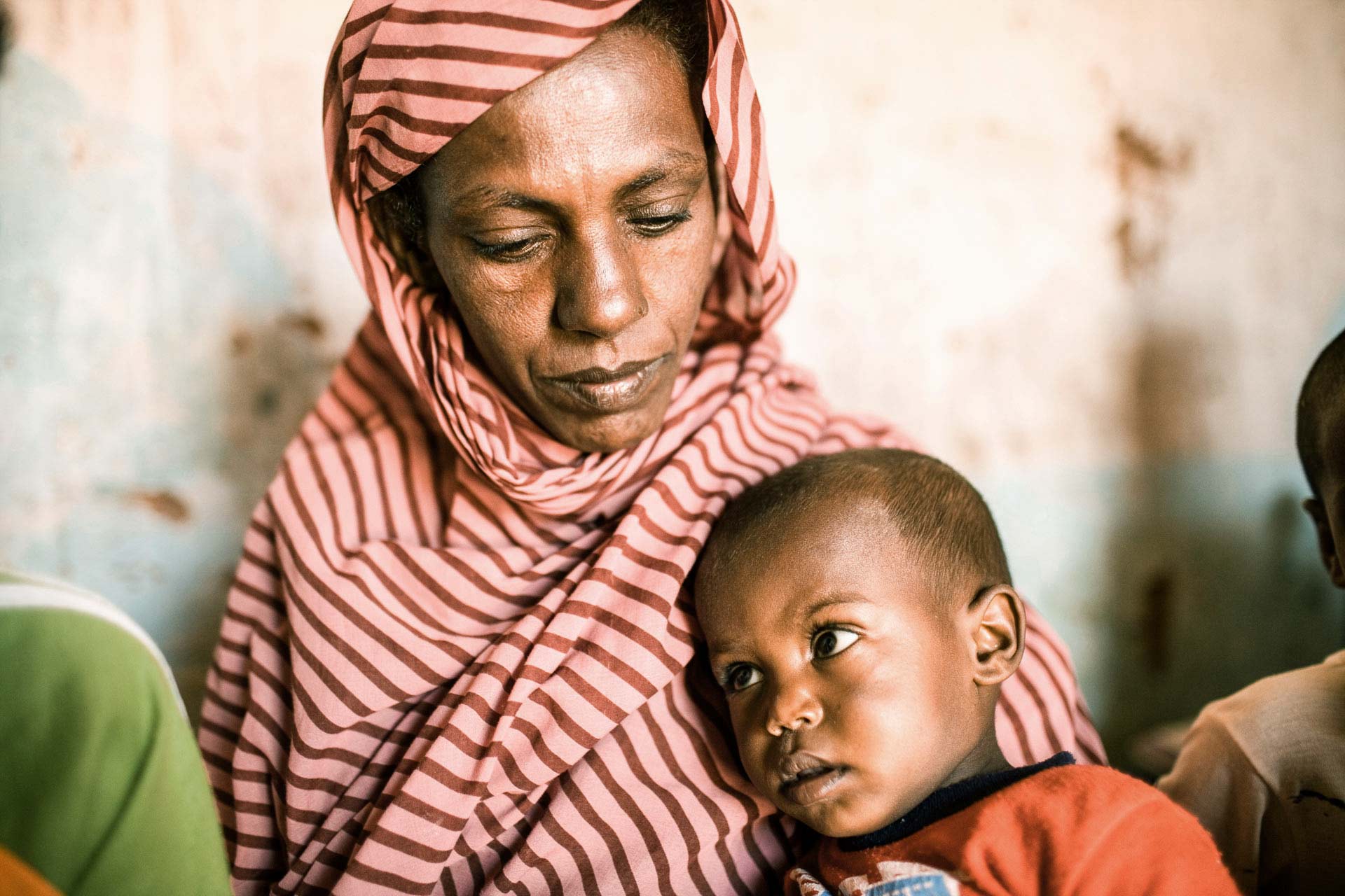 Mutter mit Kind im Sudan. Foto: Patrick Wittmann