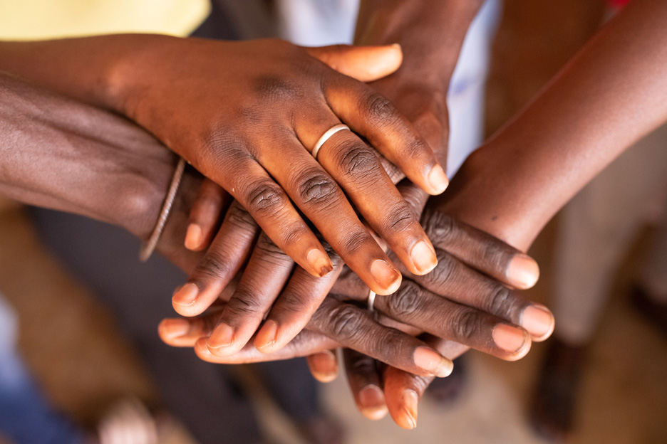 Aufeinandergelegte Hände